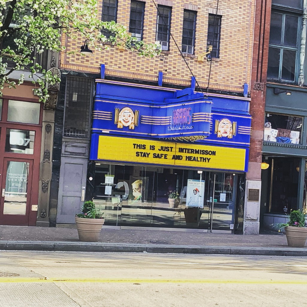 Front marquis of the Harris Theater in Pittsburgh, the text reads: THIS IS JUST INTERMISSION. STAY SAFE AND HEALTHY. 